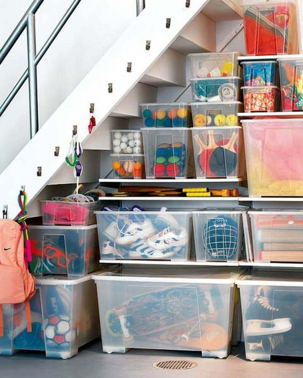 Simple Basement Storage Ideas under Stair Storage with Plastic Containers and Hangers