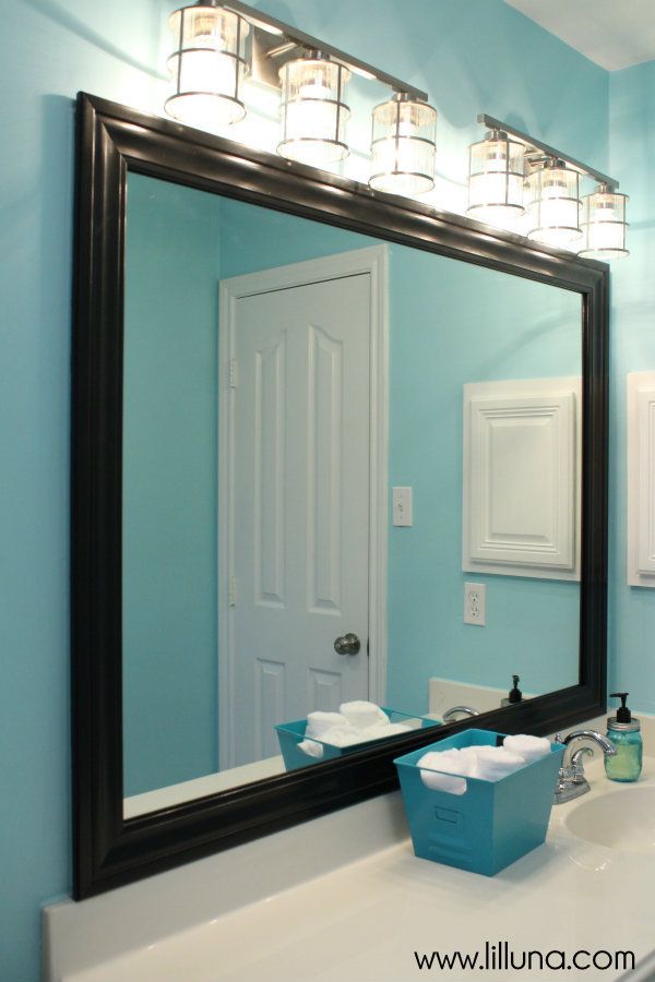 Bathroom Mirror Ideas 8. Black-Framed Mirror in Blue Bathroom - Harptimes.com