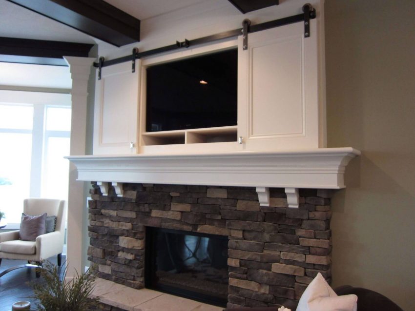 Beach House-Style Rustic Corner Fireplace with TV Above Ideas