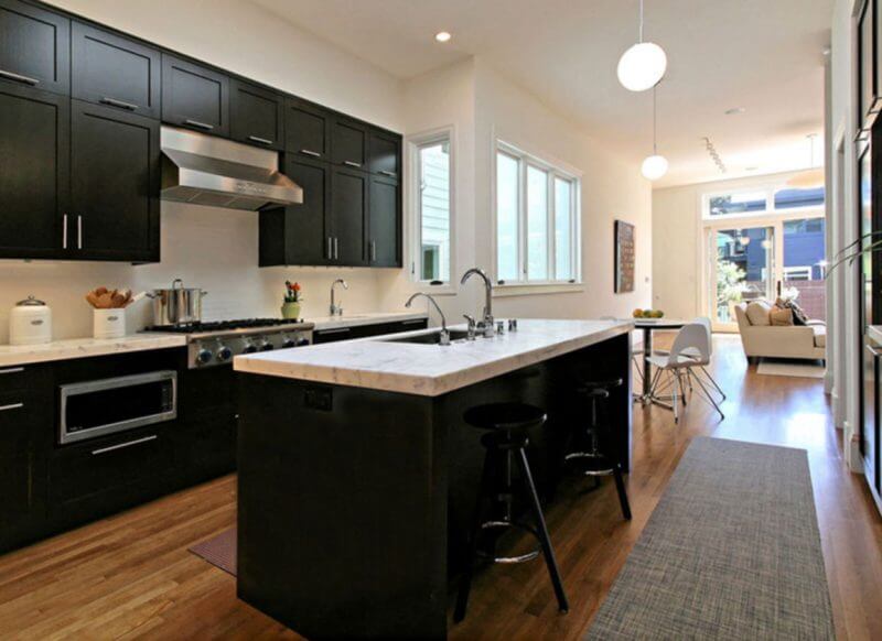 kitchens with black appliances and dark cabinets