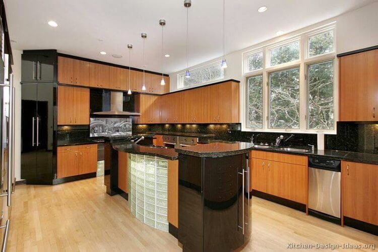 Kitchens with black appliances and glass block construction