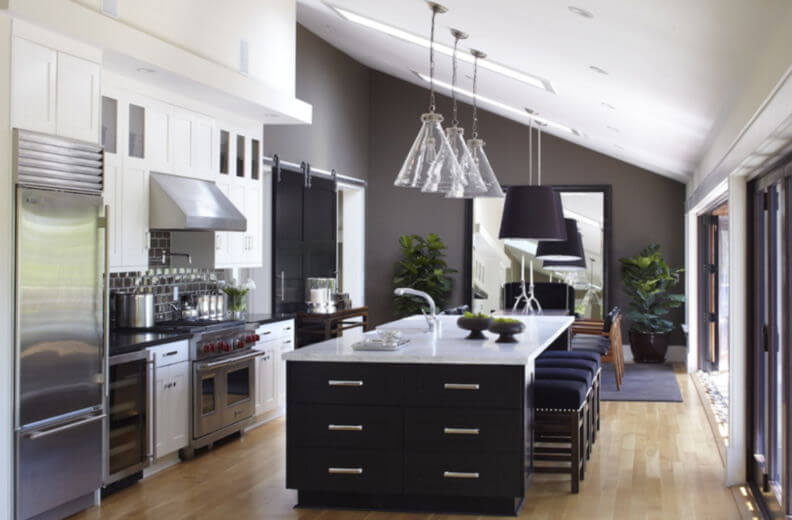 kitchens with wood cabinets and black appliances