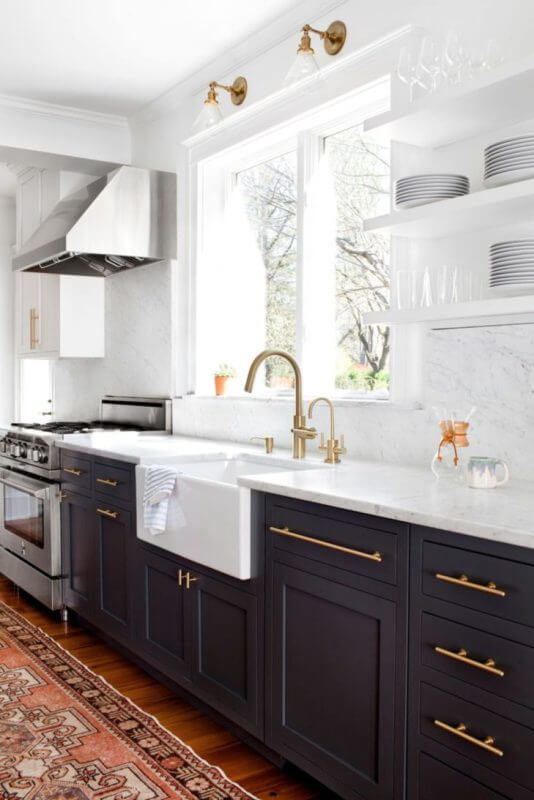 white cabinets with black stainless appliances